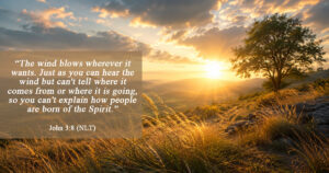Golden sunrise over rolling hills with tall grass swaying in the wind, symbolizing the unseen presence and work of the Holy Spirit.